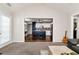View of a living room transitioning into the kitchen with stainless steel appliances at 540 Windermere Dr, Loganville, GA 30052
