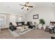 Inviting living room with a ceiling fan, comfortable seating, and stylish decor at 540 Windermere Dr, Loganville, GA 30052
