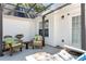Relax on the patio with comfortable seating and pergola covered in sunshine at 540 Windermere Dr, Loganville, GA 30052