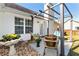 Private patio area with seating and plants, ideal for outdoor enjoyment under the pergola at 540 Windermere Dr, Loganville, GA 30052
