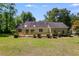 Expansive backyard features a spacious deck, perfect for outdoor entertaining at 261 Township Dr, Hiram, GA 30141