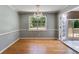 Bright dining room featuring hardwood floors, chandelier, and a large window at 261 Township Dr, Hiram, GA 30141