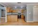 Well-lit kitchen featuring granite countertops, stainless steel appliances, and hardwood floors, offering style and functionality at 261 Township Dr, Hiram, GA 30141