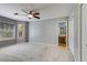 Spacious main bedroom with large windows, ceiling fan, and closet at 261 Township Dr, Hiram, GA 30141