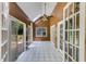 Sun room with tiled floor, ceiling fan and access to the outside patio at 261 Township Dr, Hiram, GA 30141