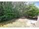 Spacious backyard with mature trees and lush green grass at 2892 Motts Cove Holw, Lawrenceville, GA 30043