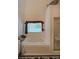 Bright bathroom features a soaking tub under a window and a glass shower at 2892 Motts Cove Holw, Lawrenceville, GA 30043