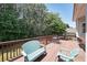 Outdoor deck with seating, overlooking a wooded lot at 2892 Motts Cove Holw, Lawrenceville, GA 30043
