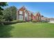 Beautiful two-story brick home with manicured front lawn at 2892 Motts Cove Holw, Lawrenceville, GA 30043