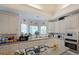 Bright and airy kitchen with stainless steel appliances, white cabinets, and central island at 2892 Motts Cove Holw, Lawrenceville, GA 30043