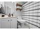 Modern bathroom featuring a sleek vanity, toilet, and a stylish shower curtain at 3174 Vickery Ne Dr, Marietta, GA 30066