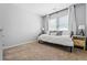 Cozy bedroom showcasing a daybed, carpet, and a window providing ample natural light at 3174 Vickery Ne Dr, Marietta, GA 30066