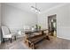 Bright dining room with a wooden table, bench, and stylish light fixture at 3174 Vickery Ne Dr, Marietta, GA 30066