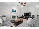 Comfortable living space with a fireplace, large TV, and a sectional sofa at 3174 Vickery Ne Dr, Marietta, GA 30066