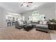 Inviting living room with a large sectional sofa and an open layout at 3174 Vickery Ne Dr, Marietta, GA 30066