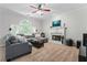 Cozy living room with a fireplace, plush seating, and an arch window at 3174 Vickery Ne Dr, Marietta, GA 30066