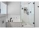 Beautiful main bathroom with a modern tub, frameless glass shower, white subway tile and black fixtures at 3174 Vickery Ne Dr, Marietta, GA 30066