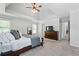 Large main bedroom featuring a tray ceiling, neutral carpet, and classic decor at 3174 Vickery Ne Dr, Marietta, GA 30066
