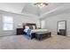Spacious main bedroom with tray ceiling, neutral carpet, large bed, and ample natural light at 3174 Vickery Ne Dr, Marietta, GA 30066