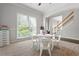 Well-lit playroom with a staircase and a large window for natural light at 3174 Vickery Ne Dr, Marietta, GA 30066
