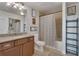 Modern bathroom featuring a stylish vanity, toilet, bathtub with shower, shelving, and decorative elements at 3300 Windy Ridge Se Pkwy # 1603, Atlanta, GA 30339