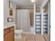 Bathroom with a vanity, toilet, bathtub with shower, and shelving with modern design at 3300 Windy Ridge Se Pkwy # 1603, Atlanta, GA 30339