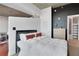 This bedroom features a comfortable bed, neutral tones, a view into the ensuite bath, and stylish accents at 3300 Windy Ridge Se Pkwy # 1603, Atlanta, GA 30339