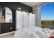 This bedroom features modern décor, a large window, and a built in wardrobe, promoting style and comfort at 3300 Windy Ridge Se Pkwy # 1603, Atlanta, GA 30339