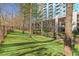 The community dog park features a fenced in grassy area with seating at 3300 Windy Ridge Se Pkwy # 1603, Atlanta, GA 30339