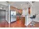 Well-designed kitchen featuring stainless appliances, counter seating, and hardwood floors at 3300 Windy Ridge Se Pkwy # 1603, Atlanta, GA 30339