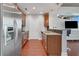 Modern kitchen with stainless steel appliances, wood cabinets, and granite countertops at 3300 Windy Ridge Se Pkwy # 1603, Atlanta, GA 30339