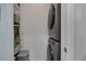 This is a view of the laundry room with a stackable washer and dryer and ample shelving space at 3300 Windy Ridge Se Pkwy # 1603, Atlanta, GA 30339