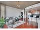 Open-concept living area connects to the kitchen, complete with bar seating, modern furniture, and plenty of light at 3300 Windy Ridge Se Pkwy # 1603, Atlanta, GA 30339
