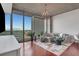 Open-concept living space with floor-to-ceiling windows and a balcony offering views of the surrounding cityscape at 3300 Windy Ridge Se Pkwy # 1603, Atlanta, GA 30339