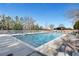 Large outdoor swimming pool with lounge chairs, set against a clear sky and tree-lined backdrop at 3300 Windy Ridge Se Pkwy # 1603, Atlanta, GA 30339