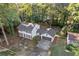 Aerial view of the house showcasing its layout, roof, and surrounding landscape at 4045 White Oak Sw Ln, Lilburn, GA 30047