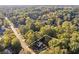 Aerial shot showcases a property in a verdant area, highlighting its tranquil location and privacy at 4045 White Oak Sw Ln, Lilburn, GA 30047