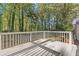View of the home's back deck overlooking the large wooded backyard space at 4045 White Oak Sw Ln, Lilburn, GA 30047