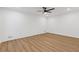 Spacious bedroom features luxury vinyl flooring, fresh white paint, recessed lights, and a modern ceiling fan at 4045 White Oak Sw Ln, Lilburn, GA 30047