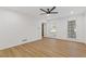 Spacious bedroom features luxury vinyl flooring, fresh white paint, recessed lights, and bright natural light at 4045 White Oak Sw Ln, Lilburn, GA 30047