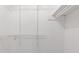 Clean white closet with adjustable shelving for easy organization and storage solutions at 4045 White Oak Sw Ln, Lilburn, GA 30047