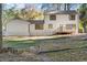A lovely view of the home's backyard and rear exterior with white siding at 4045 White Oak Sw Ln, Lilburn, GA 30047