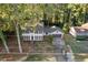 Traditional two-story home featuring a manicured front yard, two car garage, and charming facade at 4045 White Oak Sw Ln, Lilburn, GA 30047
