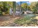 Charming two-story home features a well-manicured lawn, fresh paint, shutters, and an attached two-car garage at 4045 White Oak Sw Ln, Lilburn, GA 30047