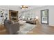 Bright living room featuring a stone fireplace, custom built-ins, and ample natural light at 4045 White Oak Sw Ln, Lilburn, GA 30047