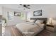 A staged main bedroom featuring new carpet, fresh paint, neutral colors, and filled with natural light at 4045 White Oak Sw Ln, Lilburn, GA 30047