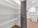 Walk-in pantry featuring ample shelving and easy access to the updated kitchen at 4045 White Oak Sw Ln, Lilburn, GA 30047