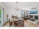 Well-lit dining area adjacent to the living room with stylish chandelier and hardwood floors at 505 Rendezvous Rd, Acworth, GA 30102