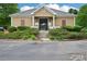 Exterior shot of the clubhouse with a beautiful landscape, ideal for gatherings at 505 Rendezvous Rd, Acworth, GA 30102
