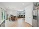 Open kitchen and dining area with stainless steel appliances and ample countertop space at 505 Rendezvous Rd, Acworth, GA 30102